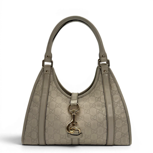 https://cdn.shopify.com/s/files/1/0564/9376/8855/files/Gucci_Schultertasche_New_Jackie_small_aus_Leder_monogram_weiss_vintage_GG7188.webp?v=1778669917