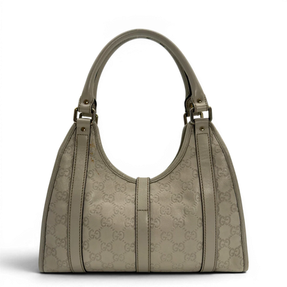 https://cdn.shopify.com/s/files/1/0564/9376/8855/files/Gucci_Schultertasche_New_Jackie_small_aus_Leder_monogram_weiss_vintage_GG7189.webp?v=1778669916