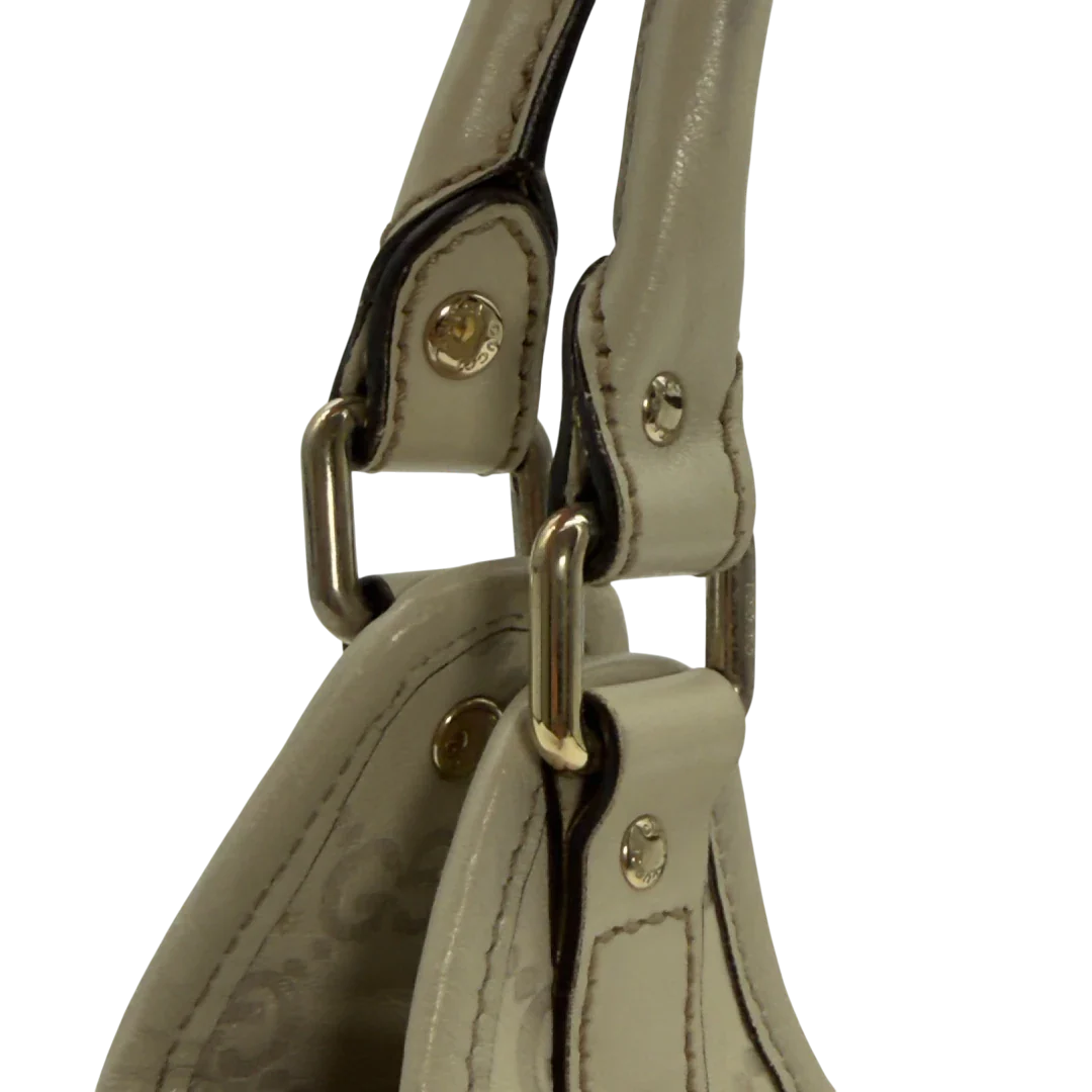 https://cdn.shopify.com/s/files/1/0564/9376/8855/files/Gucci_Schultertasche_New_Jackie_small_aus_Leder_monogram_weiss_vintage_GG7199.webp?v=1778669916