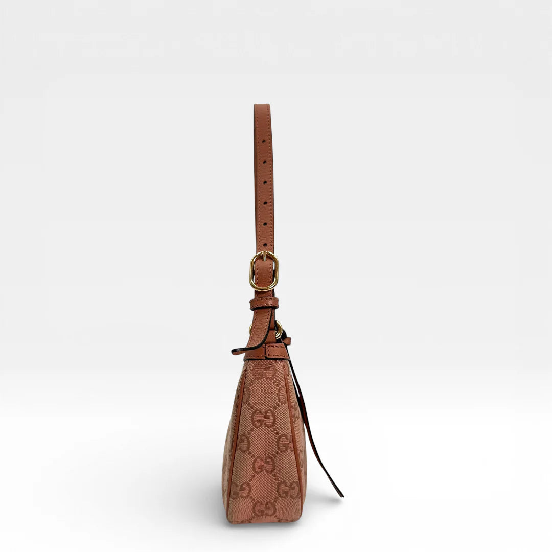 https://cdn.shopify.com/s/files/1/0564/9376/8855/files/Gucci_Schultertasche_Ophidia_Small_GG_Supreme_rosa_vintage_GG_1668.webp?v=1767925256