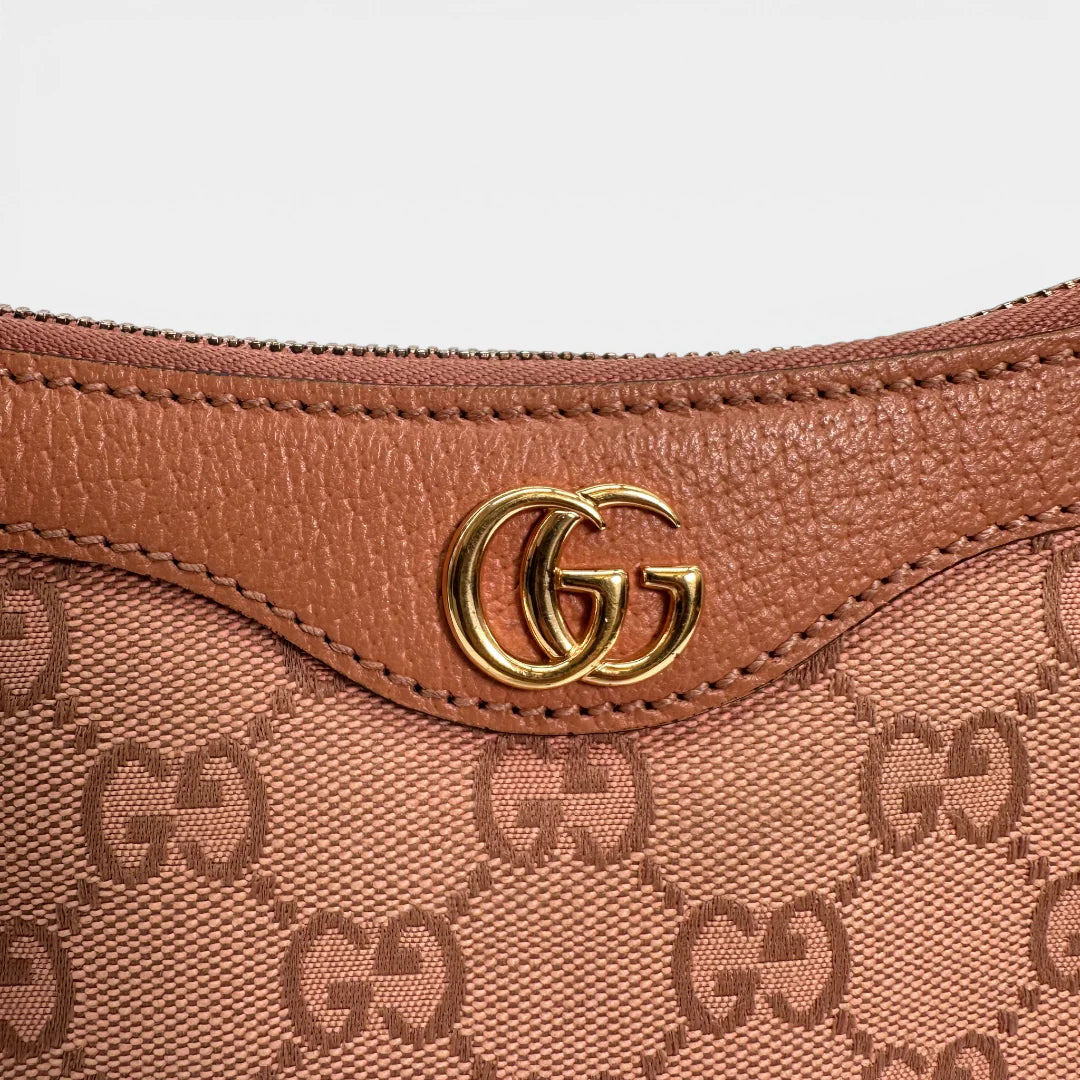 https://cdn.shopify.com/s/files/1/0564/9376/8855/files/Gucci_Schultertasche_Ophidia_Small_GG_Supreme_rosa_vintage_GG_1677.webp?v=1767925256
