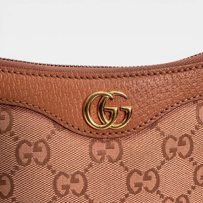 https://cdn.shopify.com/s/files/1/0564/9376/8855/files/Gucci_Schultertasche_Ophidia_Small_GG_Supreme_rosa_vintage_GG_1677.webp?v=1767925256
