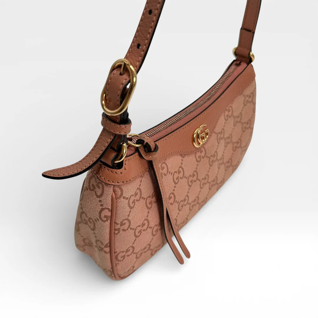 https://cdn.shopify.com/s/files/1/0564/9376/8855/files/Gucci_Schultertasche_Ophidia_Small_GG_Supreme_rosa_vintage_GG_1678.webp?v=1767925256