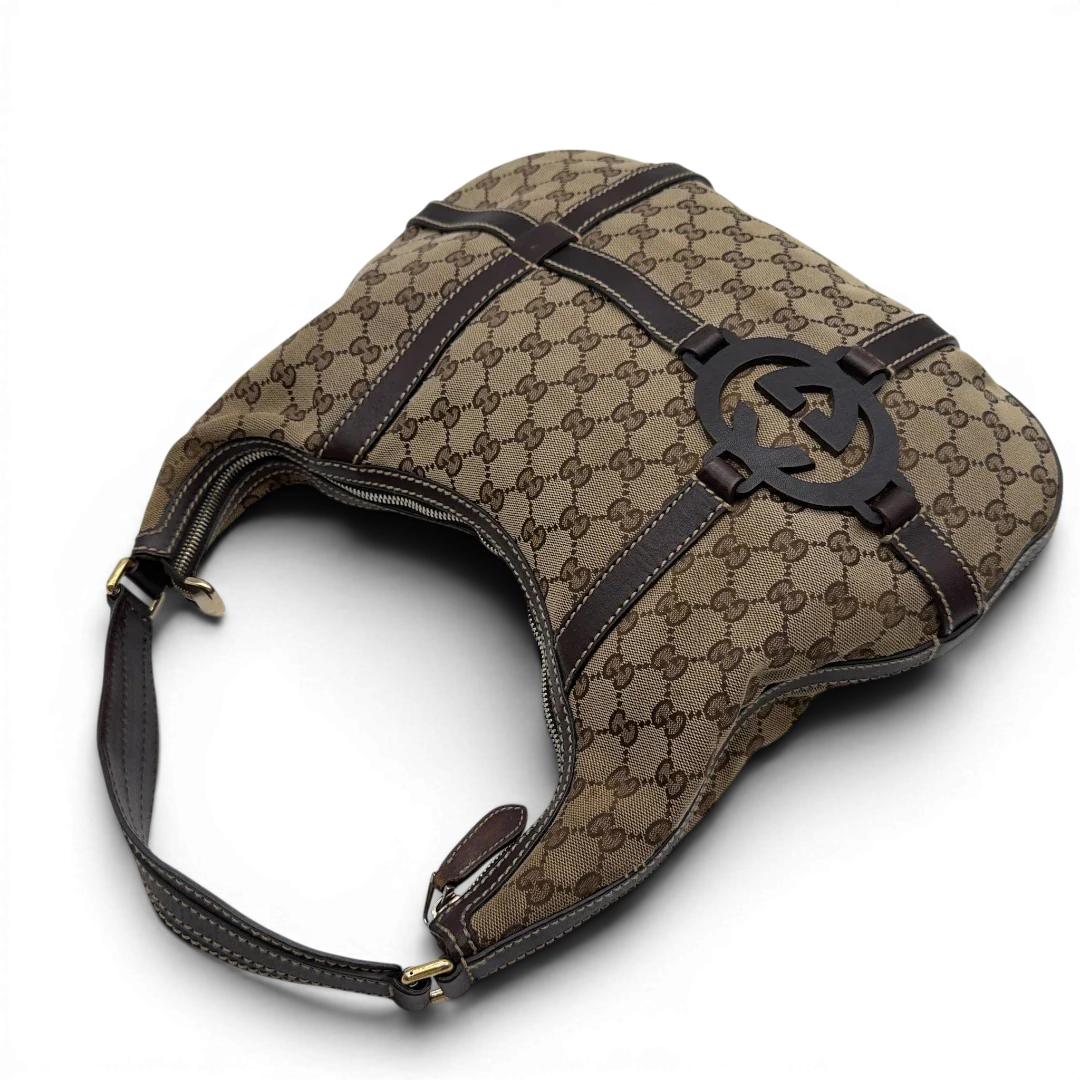 https://cdn.shopify.com/s/files/1/0564/9376/8855/files/Gucci_Schultertasche_Royal_Hobo_monogram_beige_11.webp?v=1782908724