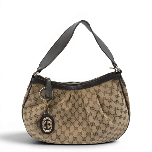 https://cdn.shopify.com/s/files/1/0564/9376/8855/files/Gucci_Schultertasche_Sukey_One_monogram_beige_19.webp?v=1782384653
