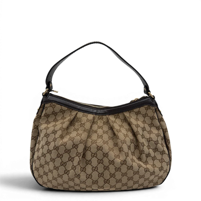 https://cdn.shopify.com/s/files/1/0564/9376/8855/files/Gucci_Schultertasche_Sukey_One_monogram_beige_2.webp?v=1781856423