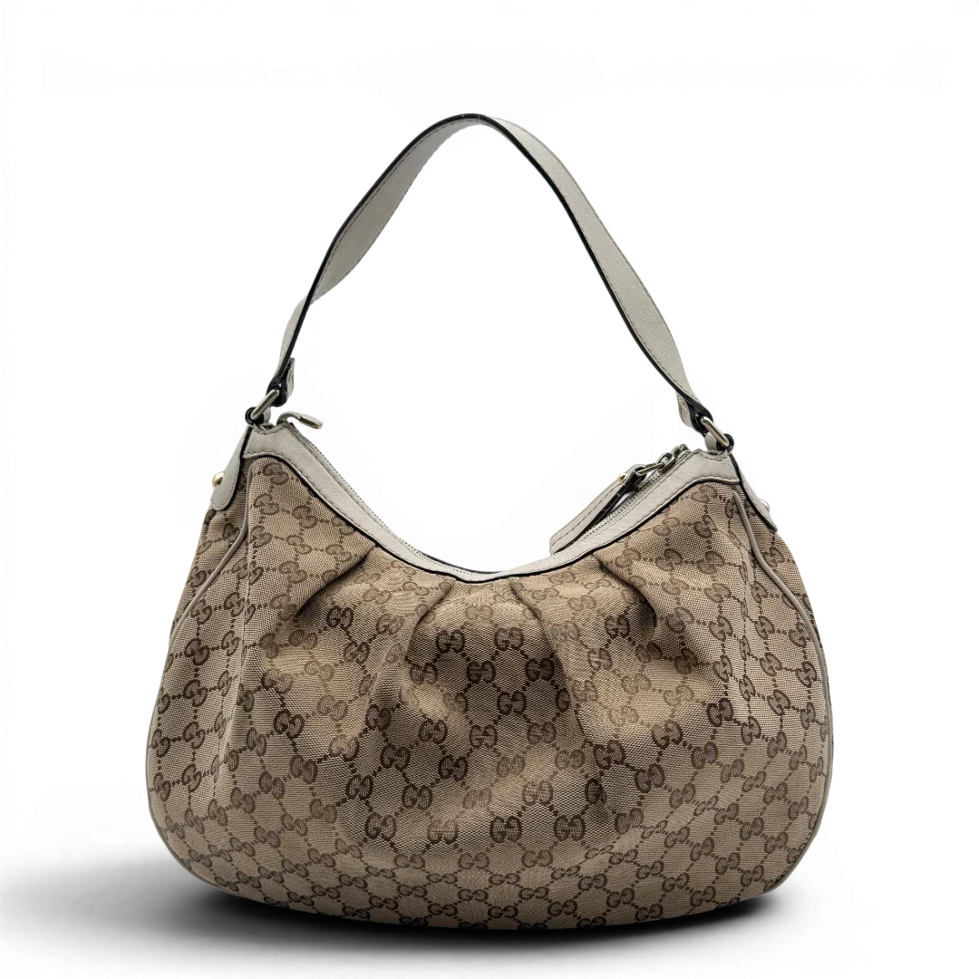 https://cdn.shopify.com/s/files/1/0564/9376/8855/files/Gucci_Schultertasche_Sukey_One_monogram_beige_2_e464035b-2927-43fe-b78a-9ee7727e925d.webp?v=1782908525