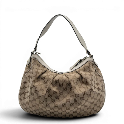 https://cdn.shopify.com/s/files/1/0564/9376/8855/files/Gucci_Schultertasche_Sukey_One_monogram_beige_2_e464035b-2927-43fe-b78a-9ee7727e925d.webp?v=1782908525