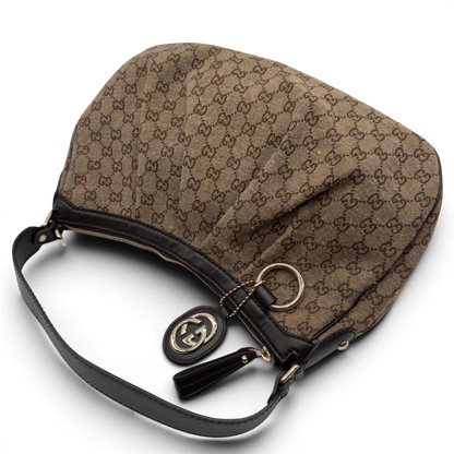 https://cdn.shopify.com/s/files/1/0564/9376/8855/files/Gucci_Schultertasche_Sukey_One_monogram_braun_10.webp?v=1782905169