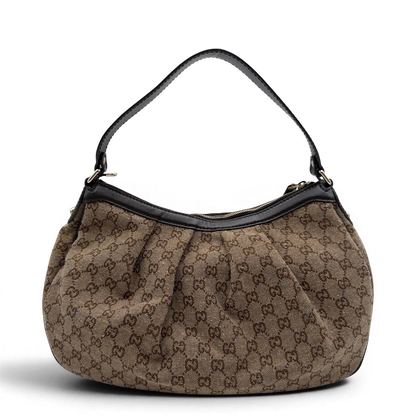 https://cdn.shopify.com/s/files/1/0564/9376/8855/files/Gucci_Schultertasche_Sukey_One_monogram_braun_2.webp?v=1782905169
