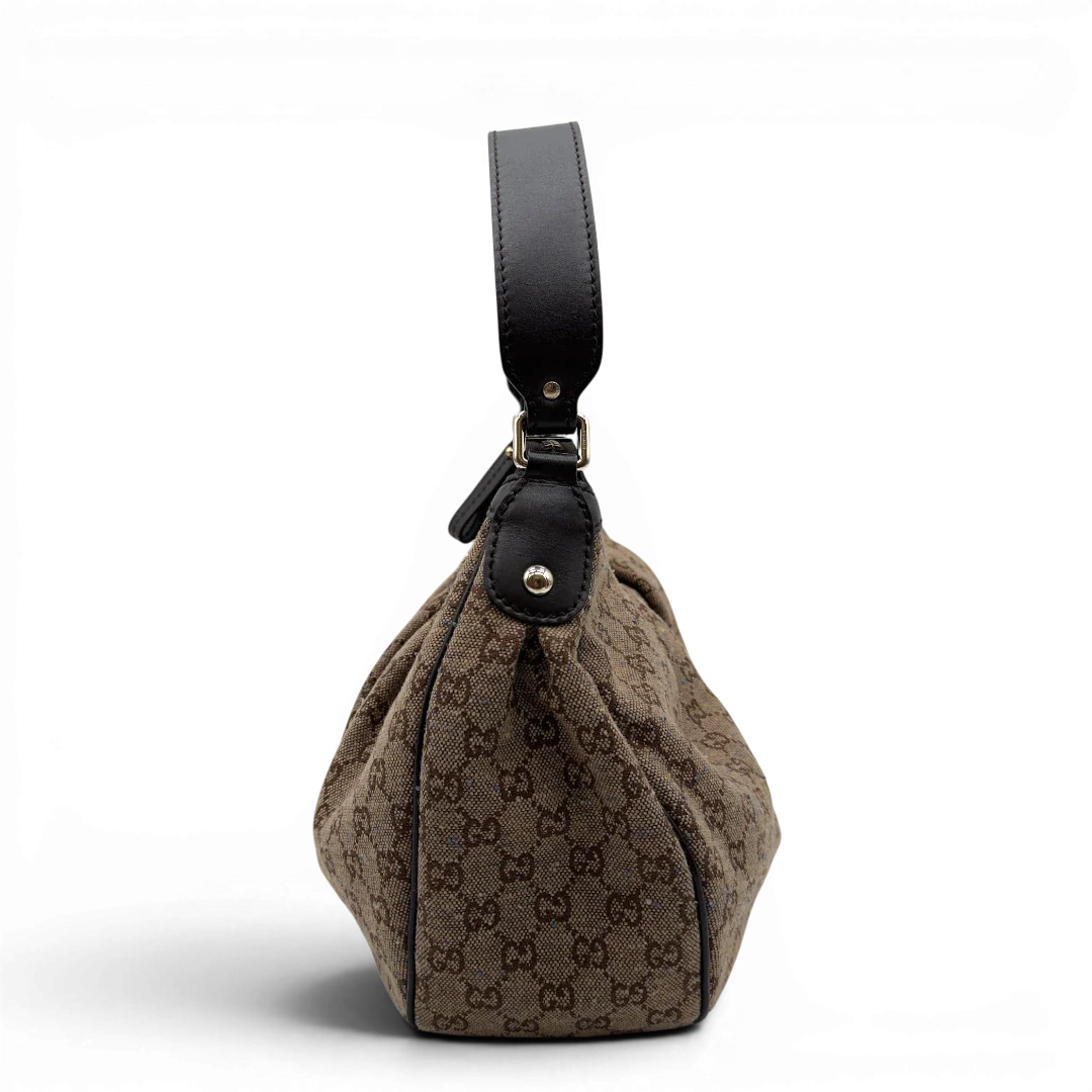 https://cdn.shopify.com/s/files/1/0564/9376/8855/files/Gucci_Schultertasche_Sukey_One_monogram_braun_3.webp?v=1782905168