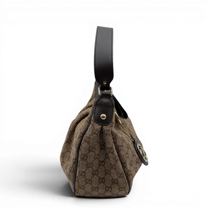 https://cdn.shopify.com/s/files/1/0564/9376/8855/files/Gucci_Schultertasche_Sukey_One_monogram_braun_4.webp?v=1782905168