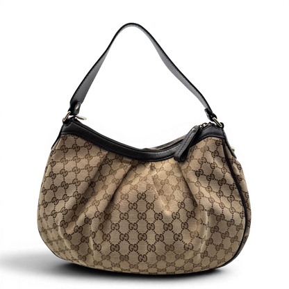 https://cdn.shopify.com/s/files/1/0564/9376/8855/files/Gucci_Schultertasche_Sukey_One_monogram_braun_4_9f945c73-0336-4b02-8e0e-6b668aebb1ce.webp?v=1783514604