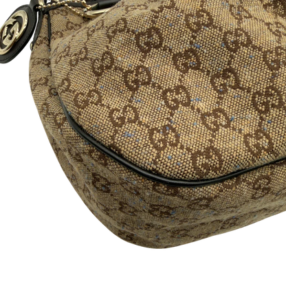 https://cdn.shopify.com/s/files/1/0564/9376/8855/files/Gucci_Schultertasche_Sukey_One_monogram_braun_7.webp?v=1782905169