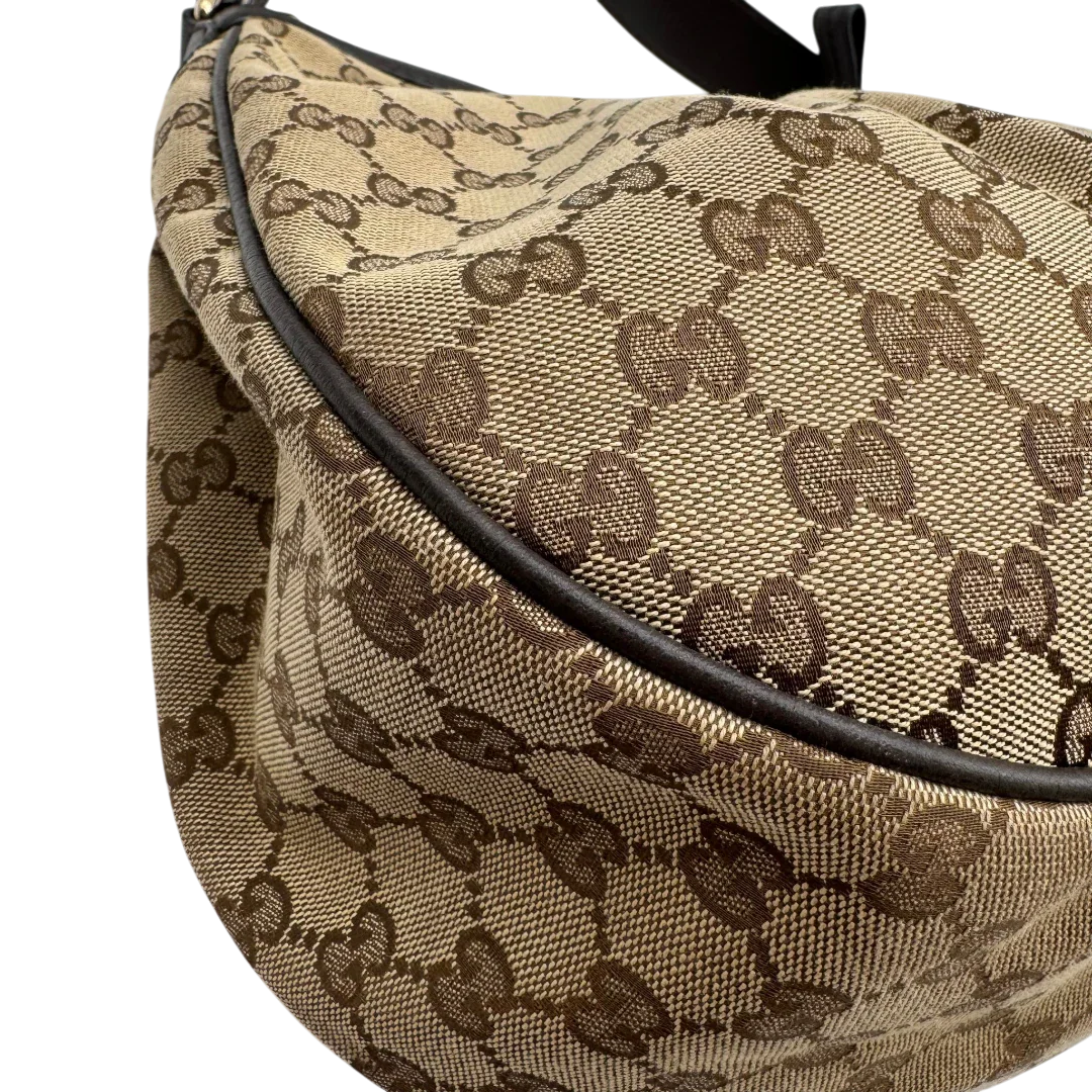 https://cdn.shopify.com/s/files/1/0564/9376/8855/files/Gucci_Schultertasche_Sukey_One_monogram_braun_8_11aebd0c-cad5-47b2-914a-30eef31dc568.webp?v=1783514604