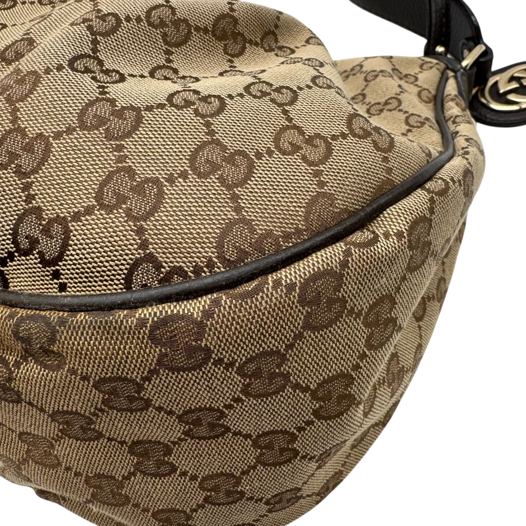 https://cdn.shopify.com/s/files/1/0564/9376/8855/files/Gucci_Schultertasche_Sukey_One_monogram_braun_9_db59db1e-f5f6-4fdd-9603-bfa8c42a5555.webp?v=1783514605