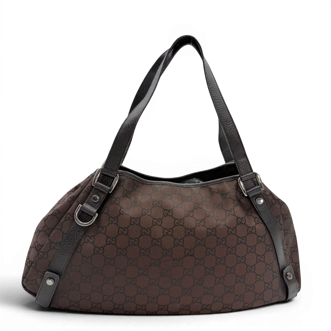 https://cdn.shopify.com/s/files/1/0564/9376/8855/files/Gucci_Shopper_Abbey_aus_Nylon_monogram_dunkelbraun_vintage_GG6401.webp?v=1778682921