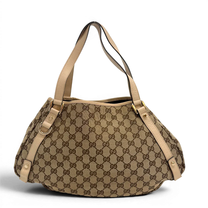 https://cdn.shopify.com/s/files/1/0564/9376/8855/files/Gucci_Shopper_Abbey_monogram_beige_vintage_GG6936.webp?v=1779320216