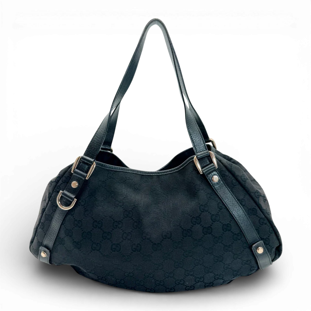 https://cdn.shopify.com/s/files/1/0564/9376/8855/files/Gucci_Shopper_Abbey_monogram_schwarz_vintage_GG_2219.webp?v=1772717157