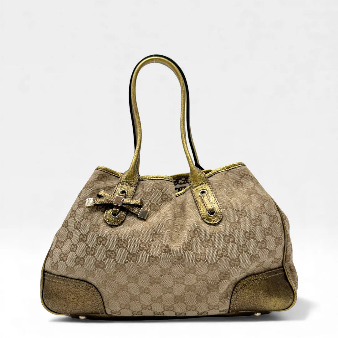 https://cdn.shopify.com/s/files/1/0564/9376/8855/files/Gucci_Shopper_Princy_monogram_beige_vintage_GG4639.webp?v=1764895539