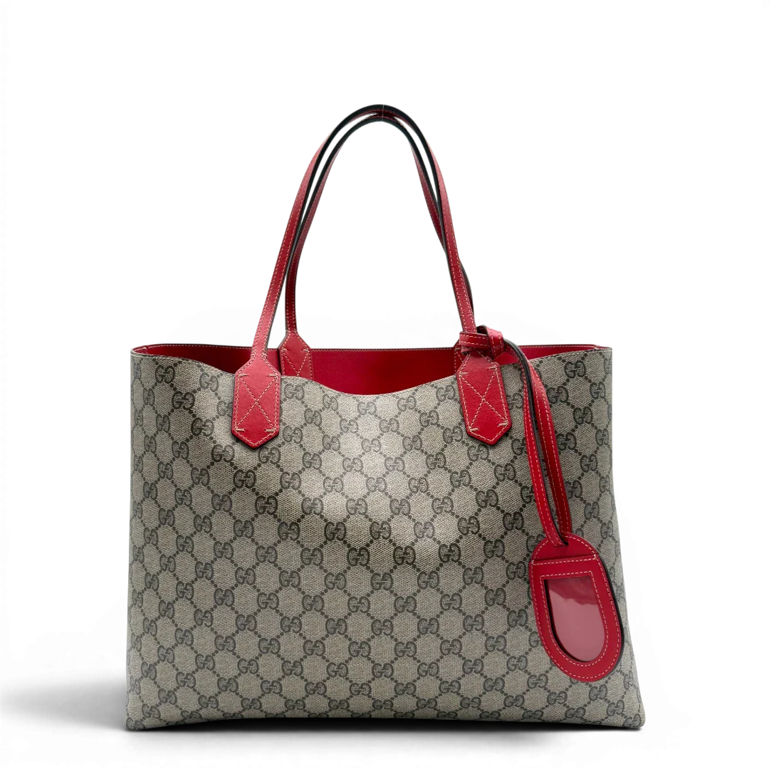https://cdn.shopify.com/s/files/1/0564/9376/8855/files/Gucci_Shopper_Reversible_Tote_GG_Supreme_monogram_beige_1.webp?v=1781713704