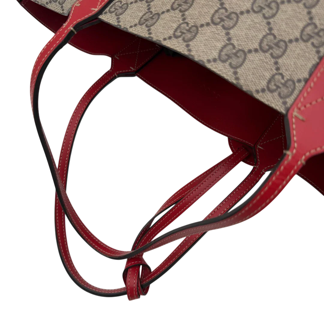 https://cdn.shopify.com/s/files/1/0564/9376/8855/files/Gucci_Shopper_Reversible_Tote_GG_Supreme_monogram_beige_10.webp?v=1781713704