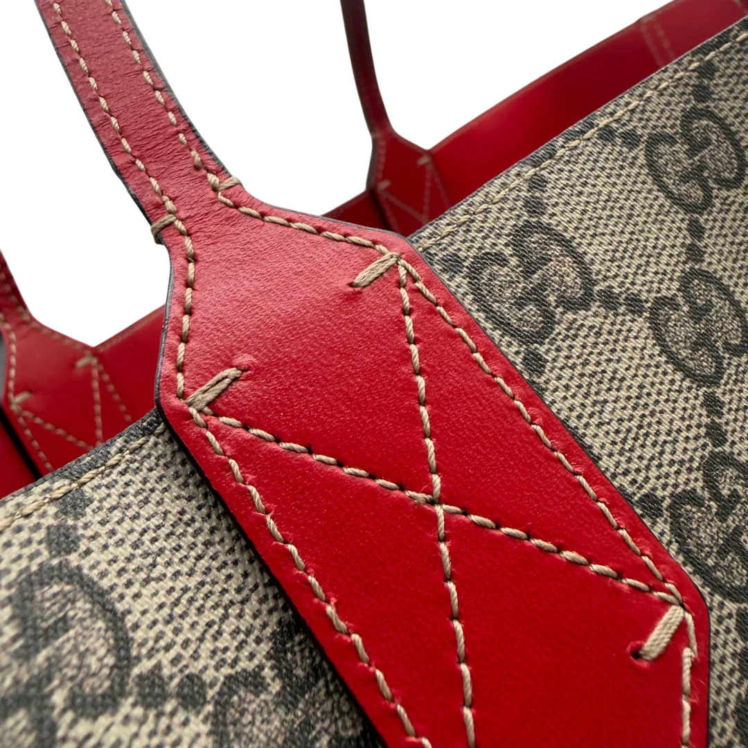 https://cdn.shopify.com/s/files/1/0564/9376/8855/files/Gucci_Shopper_Reversible_Tote_GG_Supreme_monogram_beige_12.webp?v=1781713705