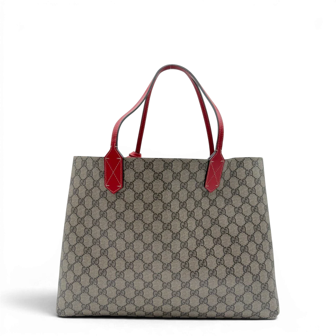 https://cdn.shopify.com/s/files/1/0564/9376/8855/files/Gucci_Shopper_Reversible_Tote_GG_Supreme_monogram_beige_2.webp?v=1781713704