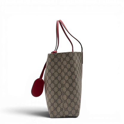 https://cdn.shopify.com/s/files/1/0564/9376/8855/files/Gucci_Shopper_Reversible_Tote_GG_Supreme_monogram_beige_3.webp?v=1781713704