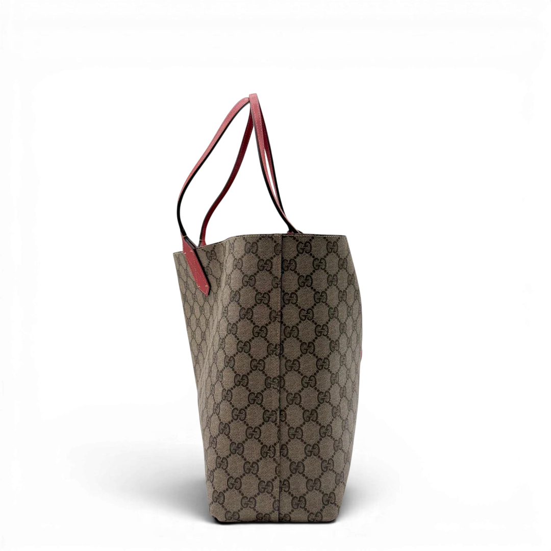 https://cdn.shopify.com/s/files/1/0564/9376/8855/files/Gucci_Shopper_Reversible_Tote_GG_Supreme_monogram_beige_4.webp?v=1781713704