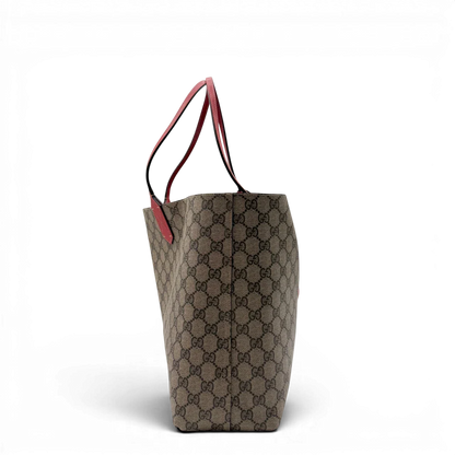 https://cdn.shopify.com/s/files/1/0564/9376/8855/files/Gucci_Shopper_Reversible_Tote_GG_Supreme_monogram_beige_4.webp?v=1781713704