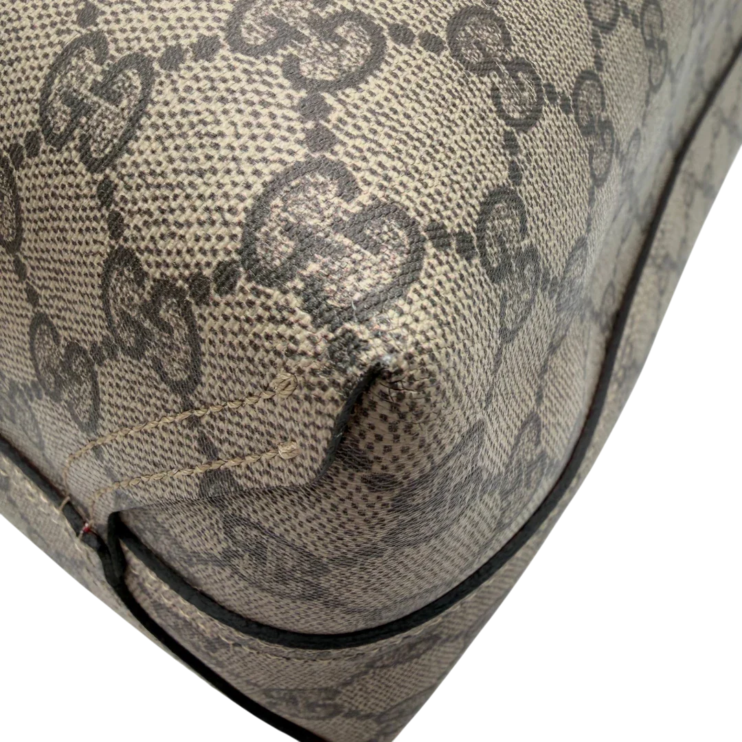 https://cdn.shopify.com/s/files/1/0564/9376/8855/files/Gucci_Shopper_Reversible_Tote_GG_Supreme_monogram_beige_6.webp?v=1781713704