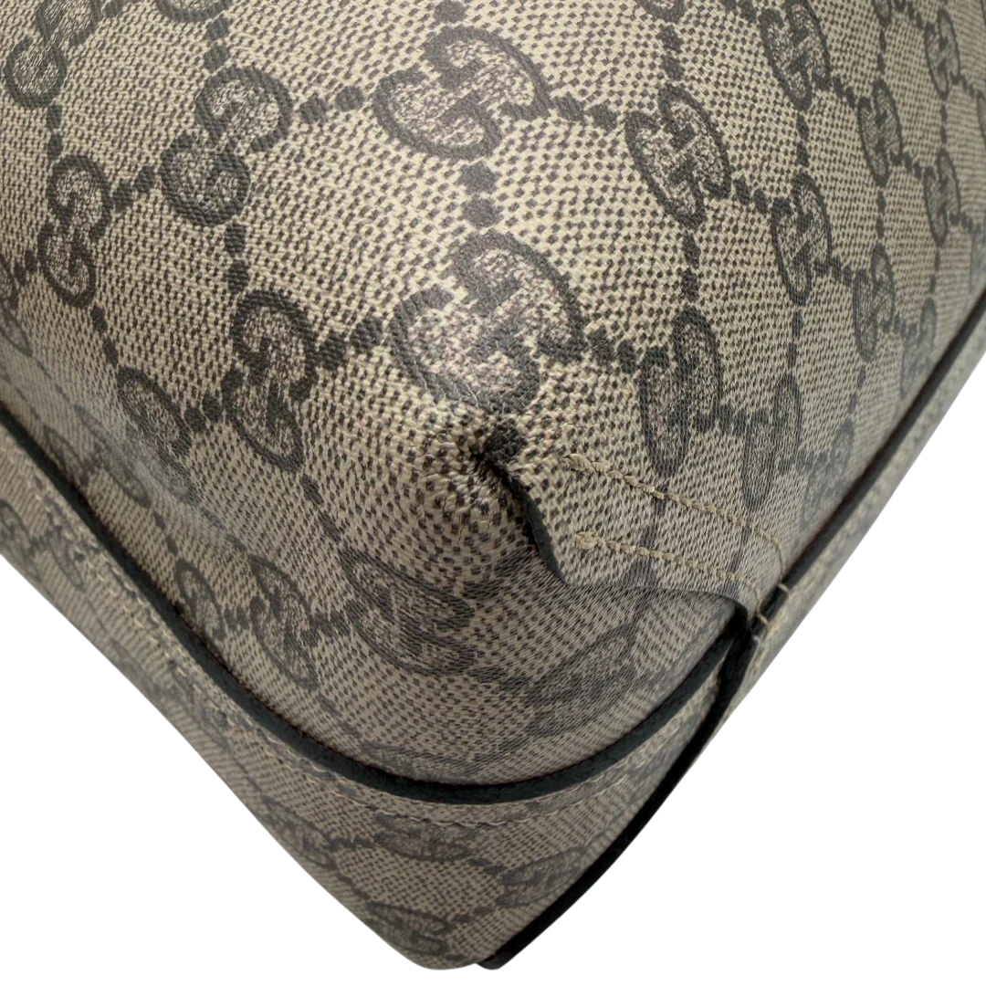 https://cdn.shopify.com/s/files/1/0564/9376/8855/files/Gucci_Shopper_Reversible_Tote_GG_Supreme_monogram_beige_7.webp?v=1781713705