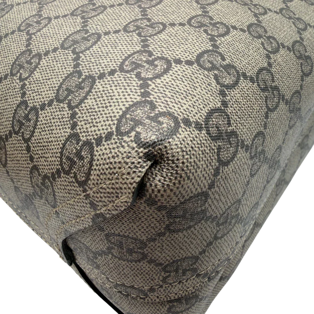 https://cdn.shopify.com/s/files/1/0564/9376/8855/files/Gucci_Shopper_Reversible_Tote_GG_Supreme_monogram_beige_8.webp?v=1781713705