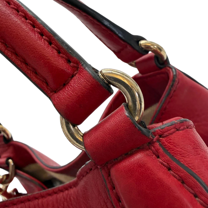 https://cdn.shopify.com/s/files/1/0564/9376/8855/files/Gucci_Shopper_Soho_Small_Leder_Rot_Interlocking_G_Umhaengegurt_Tassel_Luxury_Bag_Red_Vintage_Designer_Handtasche_Gucci_Soho_Rot_Small_Crossbody2733.webp?v=1773398547