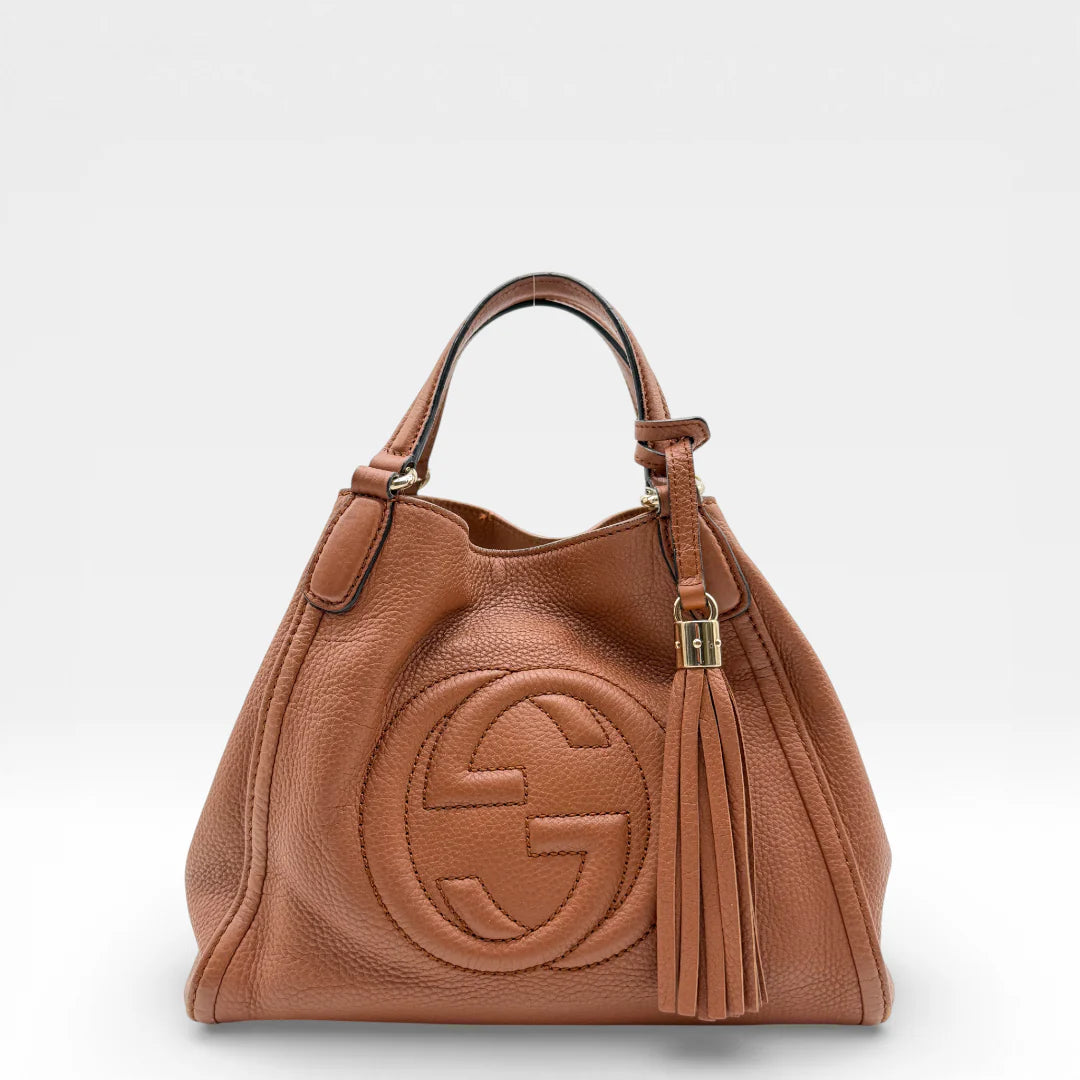 https://cdn.shopify.com/s/files/1/0564/9376/8855/files/Gucci_Shopper_Soho_aus_Leder_braun_vintage_GG_8446.webp?v=1768426296