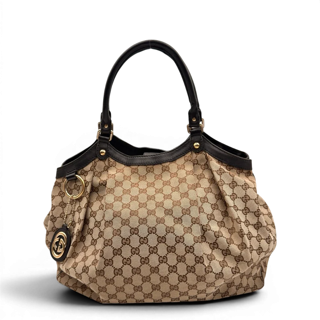 https://cdn.shopify.com/s/files/1/0564/9376/8855/files/Gucci_Shopper_Sukey_Large_monogram_beige_5_7923782d-4cc7-40ef-a6f1-0c7bebf2e656.webp?v=1784823617