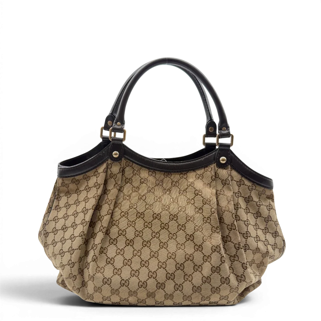 https://cdn.shopify.com/s/files/1/0564/9376/8855/files/Gucci_Shopper_Sukey_Large_monogram_beige_5_97b2d0fb-a9da-4efc-90ee-db7aad9d3268.webp?v=1784801705
