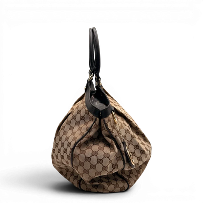 https://cdn.shopify.com/s/files/1/0564/9376/8855/files/Gucci_Shopper_Sukey_Large_monogram_beige_7_9e03b957-915c-4d53-80ac-5b61c681652a.webp?v=1784823617