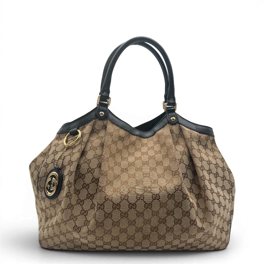 https://cdn.shopify.com/s/files/1/0564/9376/8855/files/Gucci_Shopper_Sukey_Large_monogram_beige_vintage_GG6131.webp?v=1778082641