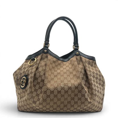 https://cdn.shopify.com/s/files/1/0564/9376/8855/files/Gucci_Shopper_Sukey_Large_monogram_beige_vintage_GG6131.webp?v=1778082641