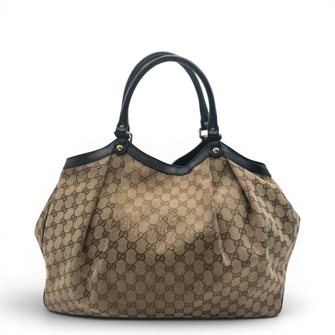 https://cdn.shopify.com/s/files/1/0564/9376/8855/files/Gucci_Shopper_Sukey_Large_monogram_beige_vintage_GG6132.webp?v=1778082641