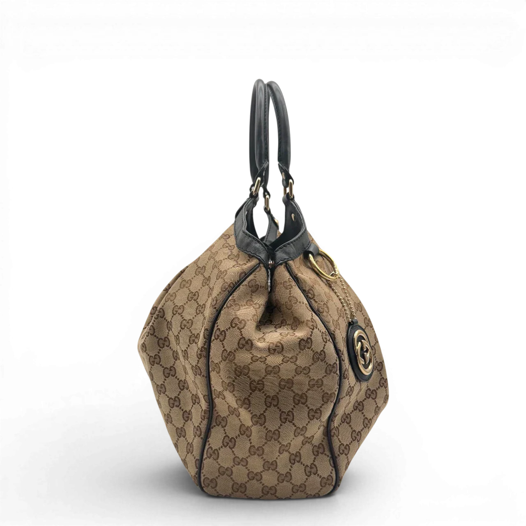 https://cdn.shopify.com/s/files/1/0564/9376/8855/files/Gucci_Shopper_Sukey_Large_monogram_beige_vintage_GG6134.webp?v=1778082641