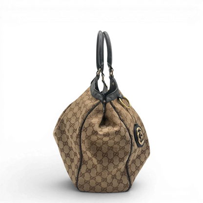 https://cdn.shopify.com/s/files/1/0564/9376/8855/files/Gucci_Shopper_Sukey_Large_monogram_beige_vintage_GG6134.webp?v=1778082641