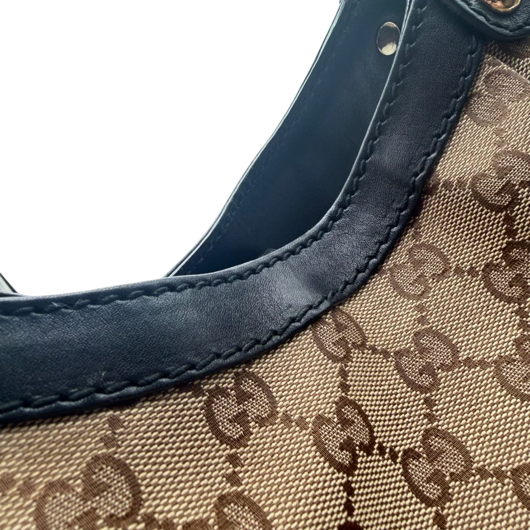 https://cdn.shopify.com/s/files/1/0564/9376/8855/files/Gucci_Shopper_Sukey_Large_monogram_beige_vintage_GG6148.webp?v=1778082642