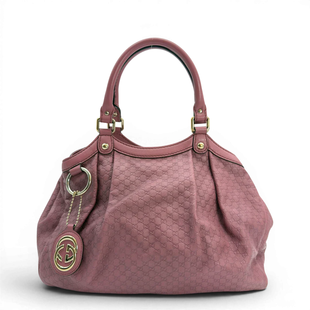 https://cdn.shopify.com/s/files/1/0564/9376/8855/files/Gucci_Shopper_Sukey_aus_Leder_monogram_rosa_vintage_GG5939.webp?v=1778066999