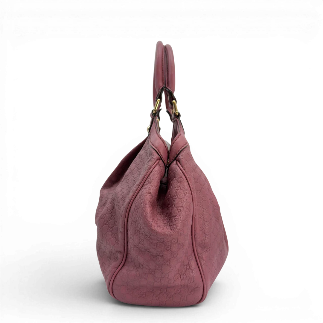 https://cdn.shopify.com/s/files/1/0564/9376/8855/files/Gucci_Shopper_Sukey_aus_Leder_monogram_rosa_vintage_GG5943.webp?v=1778066999
