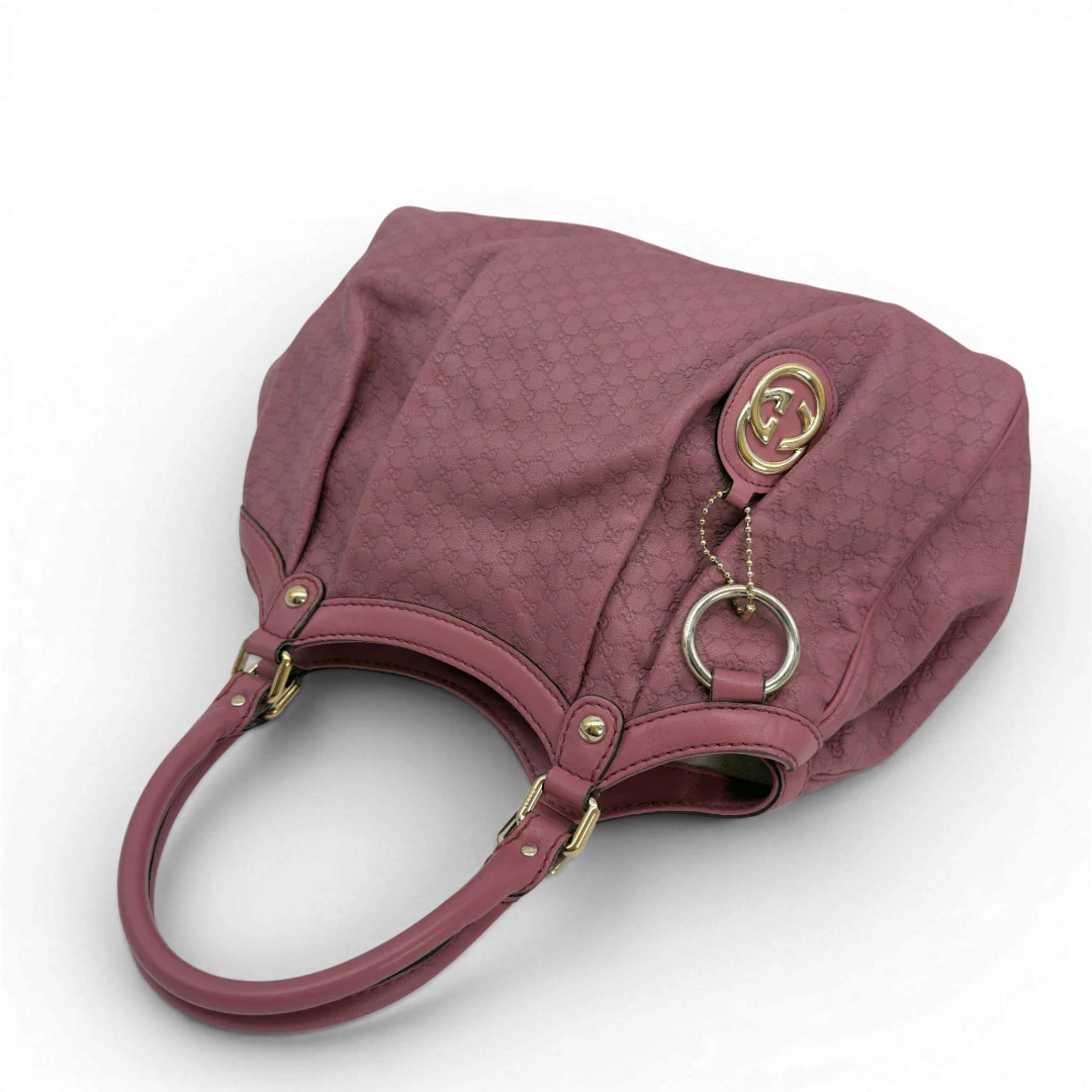 https://cdn.shopify.com/s/files/1/0564/9376/8855/files/Gucci_Shopper_Sukey_aus_Leder_monogram_rosa_vintage_GG5951.webp?v=1778066999