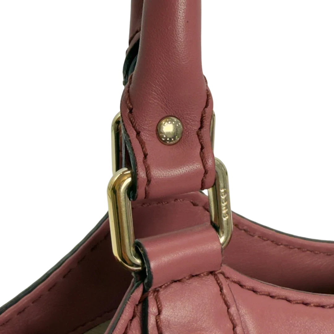 https://cdn.shopify.com/s/files/1/0564/9376/8855/files/Gucci_Shopper_Sukey_aus_Leder_monogram_rosa_vintage_GG5956.webp?v=1778066999