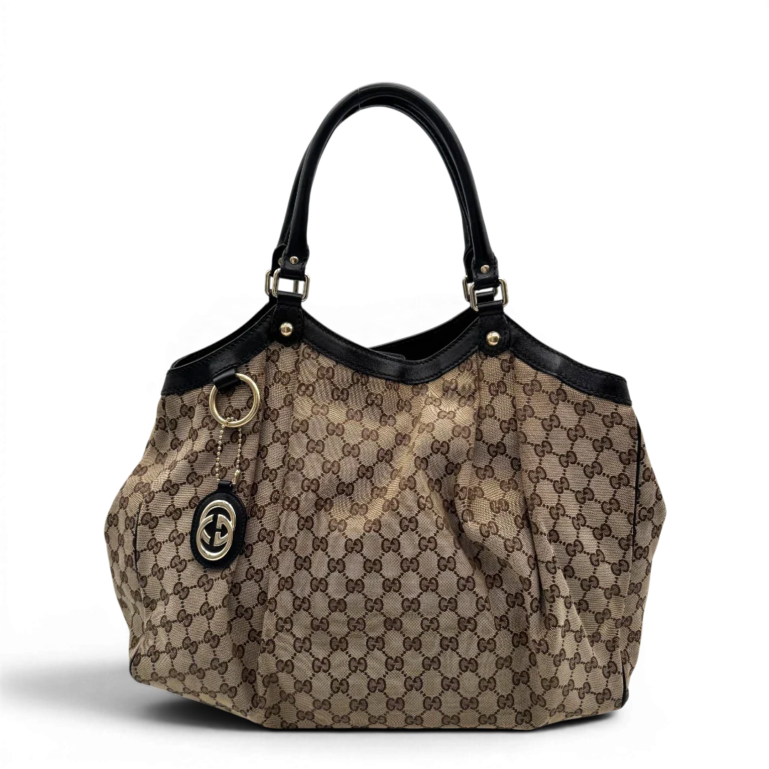 https://cdn.shopify.com/s/files/1/0564/9376/8855/files/Gucci_Shopper_Sukey_large_monogram_beige_1.webp?v=1781106235